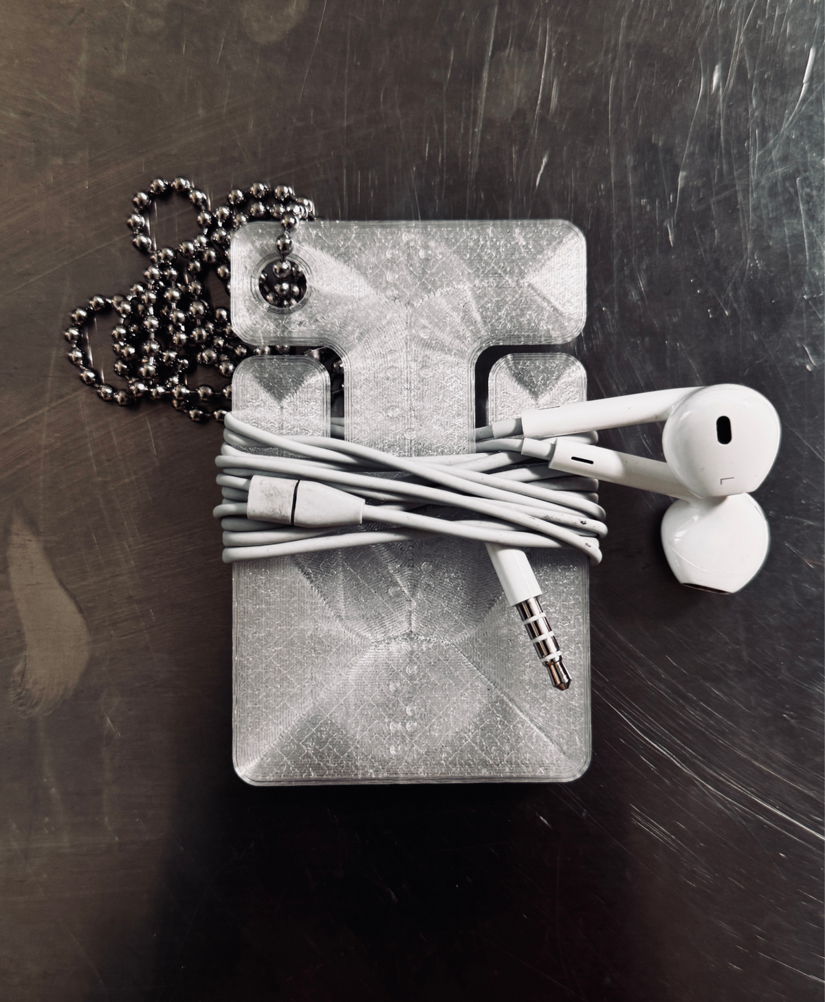 cable frame crystal with earphones wrapped around it