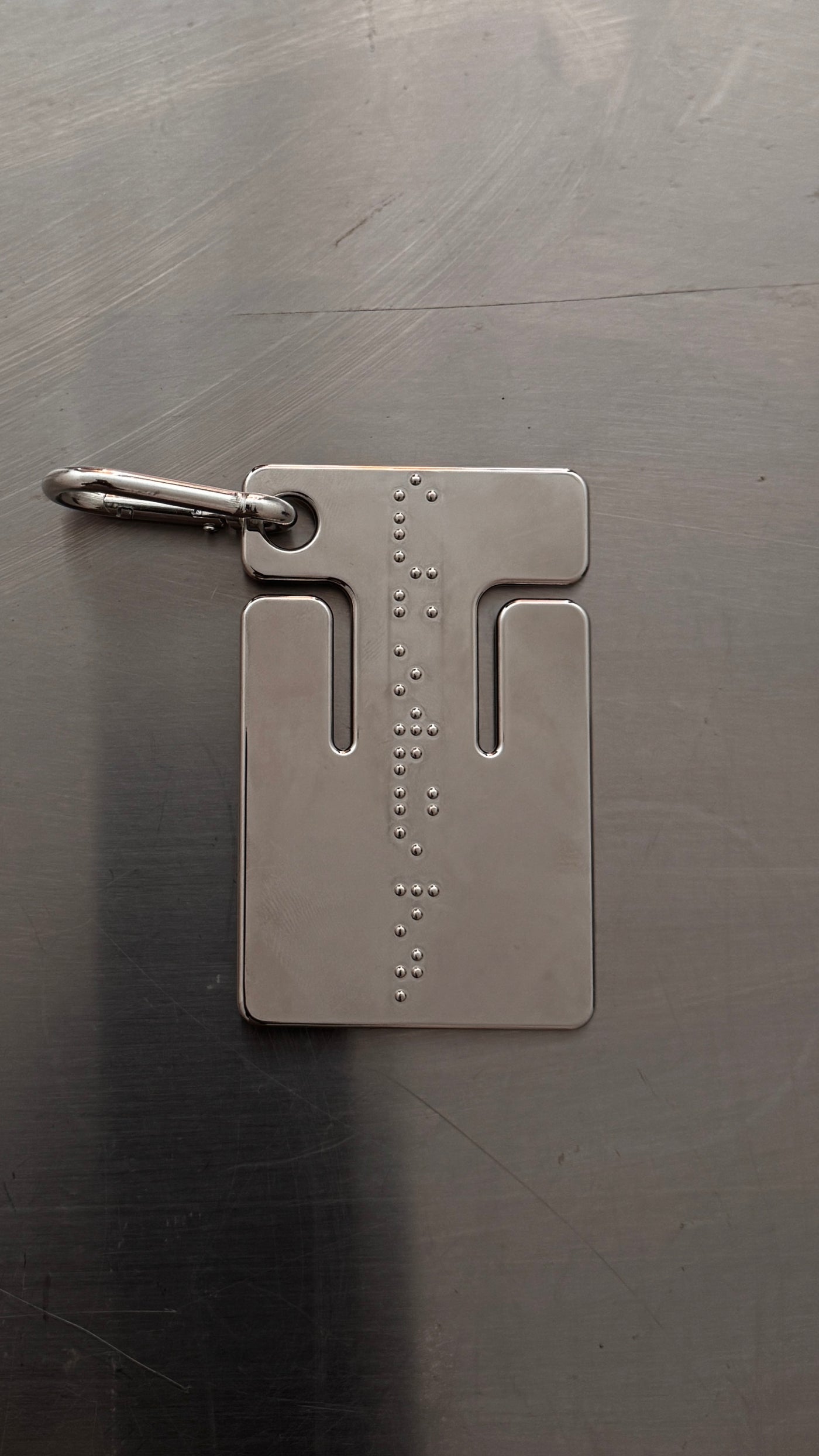 cable frame chrome — polished stainless frame with braille detailing and carabiner clip