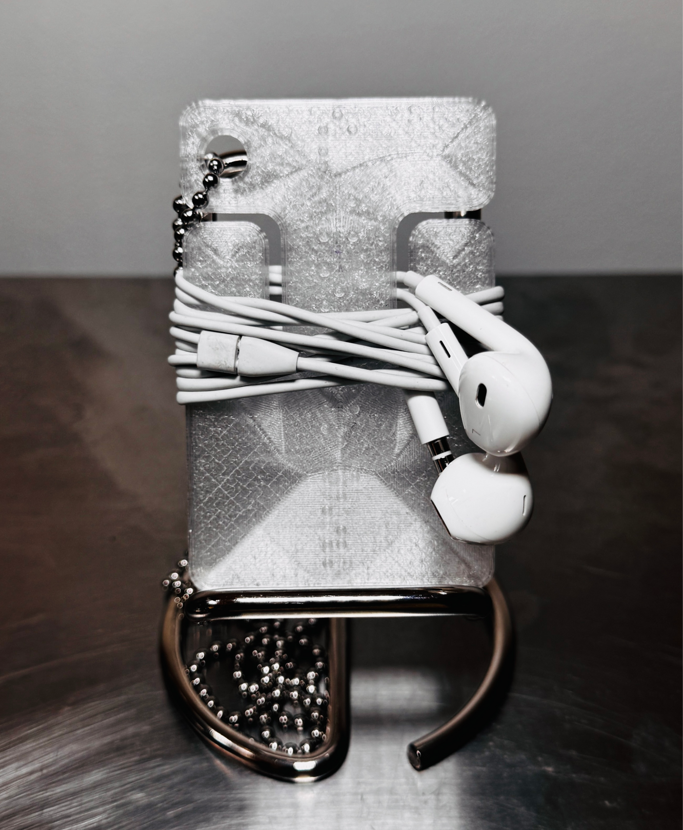 cable frame crystal standing upright with wrapped earphones